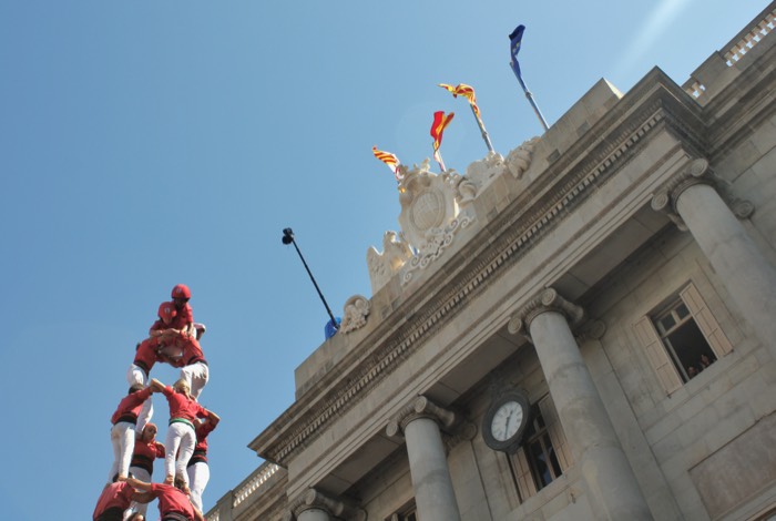 Castellers raising a tower in front of City Hall, Barcelona. 2026